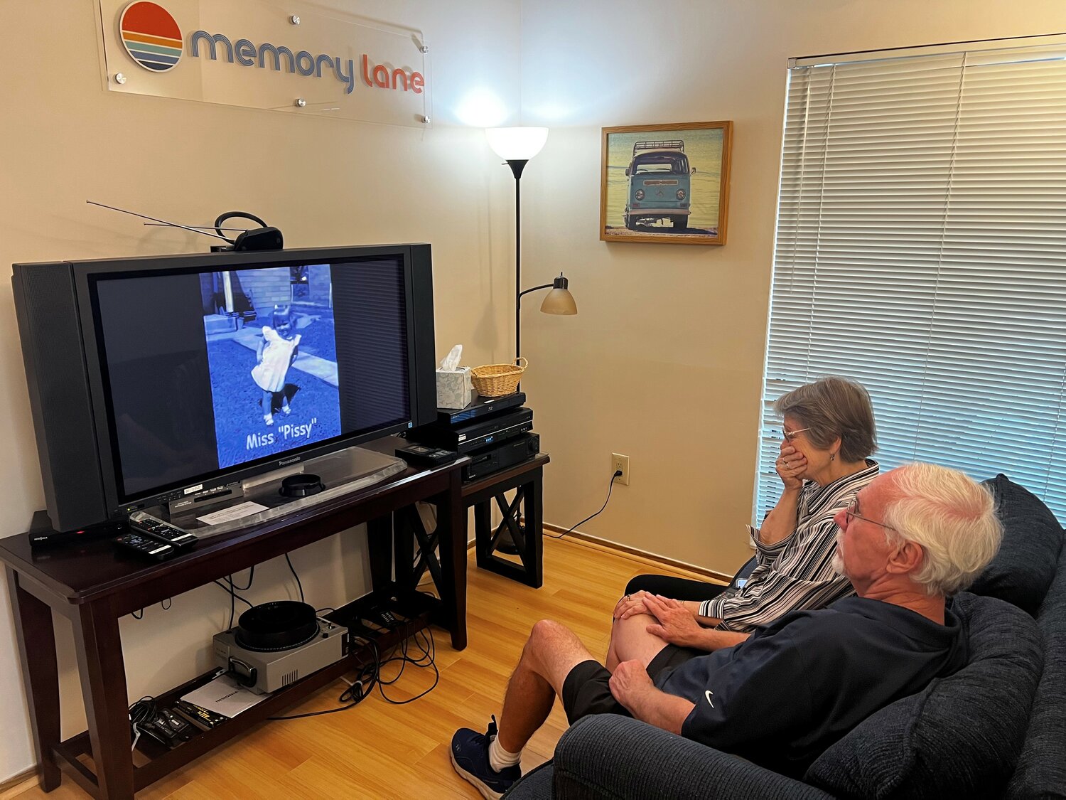 Customers relax in Memory Lane’s preview room to review video they recorded many years prior